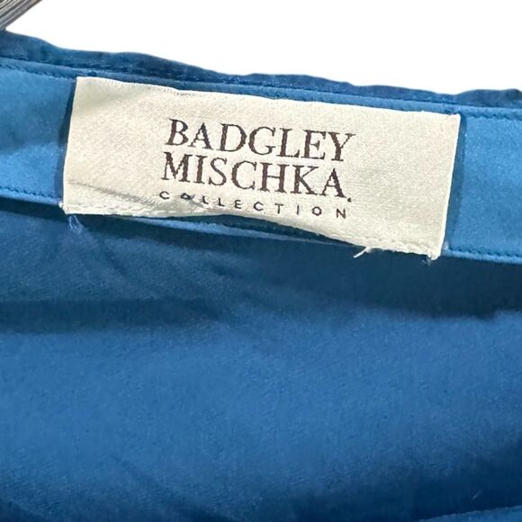 Silky Badgley Mischka capelet top blue with emblem -missing one stone MED - Picture 2 of 3